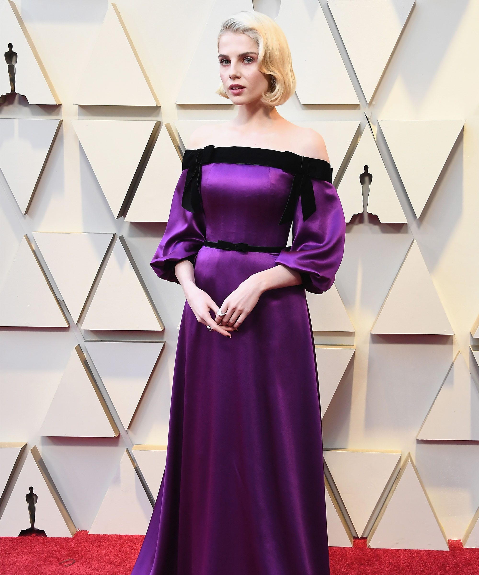 far, she wore an off-the-shoulder purple crepe satin and black